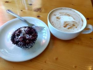 Chai latte with almond milk and a raw peanut butter cake at Blue Apples in Halifax