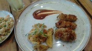 Fried cauliflower nuggets and side dishes at El Jardín de Jazmín in Lima