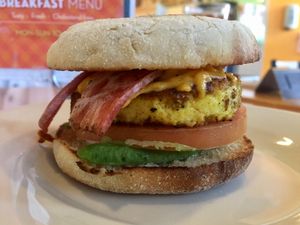 Vegan egg muffin with bac-un, avocado and tomato  at One Veg World in Pasadena