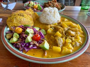 Cotopaxi - potatoes and oyster mushrooms in a creamy and mildly spiced sauce, with rice, side salad and fried plantain tostones. This was under $6!  at Mishqui Quinde Sweet Hummingbird in Mindo