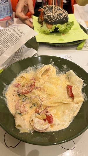 Smoky burger and ravioli formaggio vegan e or rica - tasteee!!  at Universo Vegano in Florence