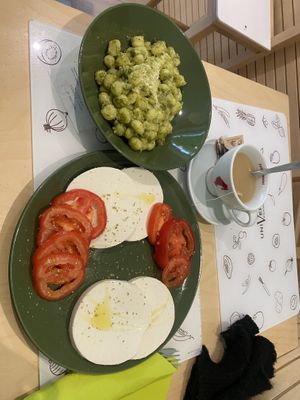 pesto gnocchi and caprese ! both were amazing   at Universo Vegano in Florence
