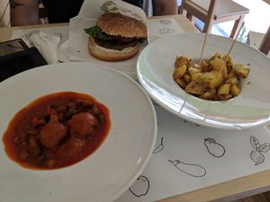 Meatballs, vegan burger, and herby potatoes! at Universo Vegano in Florence