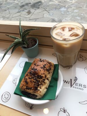Vegan Iced coffee and vegan chocolate croissant yummm at Universo Vegano in Florence