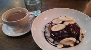 Cappuccino + Pancakes with bananas, chocolate, and hazelnuts at Raw Food Rebellion Cafe in Belfast