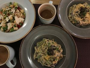 Hot cocoa, spaghetti with “cheese” sauce & mushrooms and soy Caesar salad with parmesan chips. 💚 (January 2020)  at Bhajan Cafe in Riga