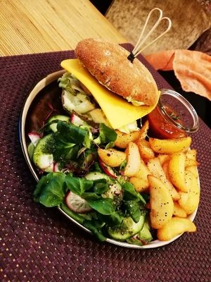 Chickpea and sun dried tomato cheesburger with tzatziki sauce.  at Bhajan Cafe in Riga