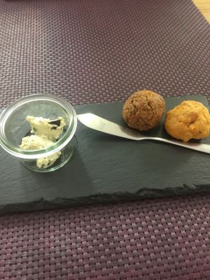 Free starters. Little bread ball with olive pate  at Bhajan Cafe in Riga