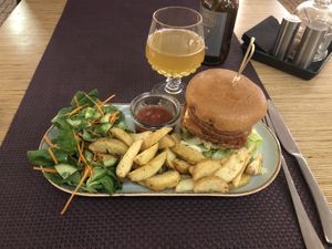 Big Burger with Salad and Potato Wedges  at Bhajan Cafe in Riga