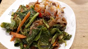 Wide noodles and greens plate with steamed radish cake! at Im Jai - Veg Food Stall in Chiang Mai