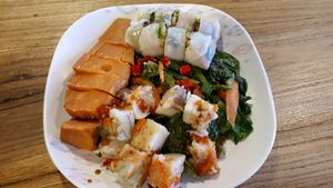 Sweet potato, radish cake, greens and spring rolls at Im Jai - Veg Food Stall in Chiang Mai