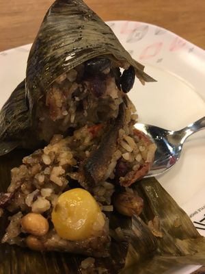 Sticky rice in a banana leaf with seitan, peanuts, lotus beans, etc. for 30 baht  at Im Jai - Veg Food Stall in Chiang Mai