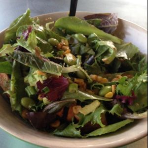large salad with baby greens, roasted corn, green onion, edamame, & avocado  at MAD Greens in Scottsdale