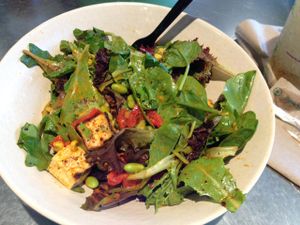 large 'create your own' salad: mixed greens, tofu, edamame, avocado, roasted corn, red peppers, mad spice, & red pepper dressing at MAD Greens in Tempe