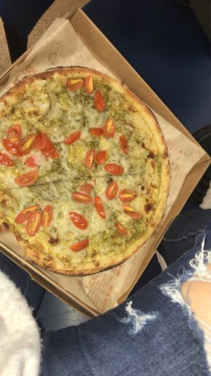 Pizza with pesto sauce vegan cheese and tomato 😍 at Blaze Pizza - O'Keefe Ave in New Orleans