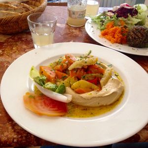 Hummus with oven-baked vegetables and bread.  at Huber in Freiburg