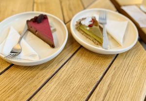 Hibiscus & pomegranate salted chocolate cake (left) and Matcha Mango Pie  at Naspolya Nassolda in Budapest