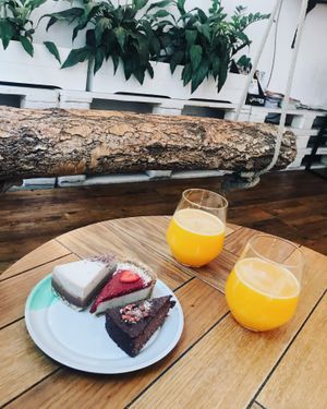 3 raw cakes and fresh orange juice at Naspolya Nassolda in Budapest