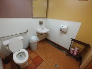 Dirty bathroom no ventilation, poor hand dryer, no baby changing station at Judahlicious in San Francisco