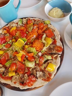 Vegan pizza with cashew & tofu cheese on the side. Really good👌 at Peppermaint Guesthouse in Chiang Mai