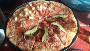 half Hawaiian half Mexican pizza  at U.to.pi.a in Mexico City