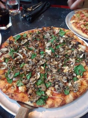 Vegan pizza with sauteed mushrooms, spinach, onions and vegan ricotta.  at Salvatore's  in Halifax