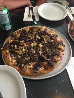 Medium pizza with olives, mushrooms, vegan portobello sausage and vegan ricotta & parm at Salvatore's  in Halifax