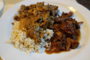 Hot food from the buffet - mock meat in pepper sauce, and tofu with champignons.  at Country Life Restaurant in Prague