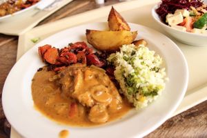 seitan stroganoff with thai rice, baked potatoes and carrots at Country Life Restaurant in Prague