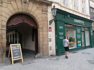 Enter via the courtyard to the right of the shop at Country Life Restaurant in Prague