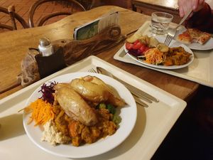 Potato wedges and soya pumpkin dish with salad at Country Life Restaurant in Prague