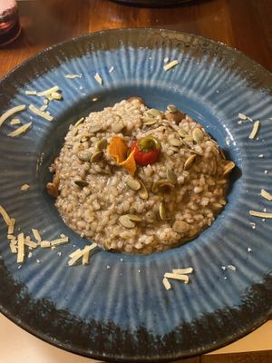 Wild mushroom risotto - cheese (unsure if vegan or lacto) was sprinkled around the perimeter of the plate!!!!  at Matoni in Split