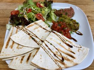 Quesadillas filled with mushrooms, plus guacamole, bean mushroom and salsa on salad (vegan) at LOLA was here in Berlin