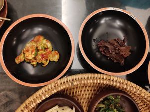 Spicy pickled cucumbers and some unpleasant dark red leafy things at SanChon Korean Temple Cooking - 산촌 사찰음식전문점 in Seoul