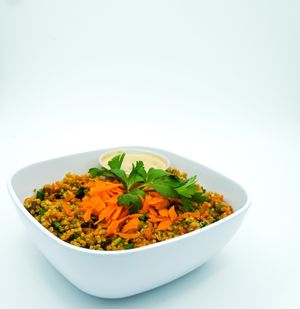 Quinoa Bowl:Quinoa with sprouted pumpkin seeds, raisins, shredded carrots, chopped pecans, celery, parsley, lime juice and balsamic. Served with an almond pad Thai dressing. at You Cafe in Siesta Key