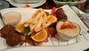 FALAFELZONE 
Best home cooked delicacies falafel in falafelzone...open kitchen, the menu includes vegetarian, vegan, and raw options. Gluten-free bread ,vegan burger buns that is served at Falafelzone.Flavored with spices and herbs and usually served in pita or a wrap or dishes, the best are crispy on the outside and served so hot that steam rises from the soft center as you take your first bite.The ingredients are fresh and the falafels are flavored and cooked to crispy perfection.All spices are coming from Egypt ...

Falafel zone stands in the heart of Beyoğlu, just a stone's throw from istiklal street. The restaurant has quickly become a favorite among vegetarians and vegans, foreigners and locals alike. If you are looking for an on-the-go lunch and want something different from the fresh food and tasty dishes about falafel and vegetable rolls, Falafel zone is a perfect solution.As soon as you enter the Istiklal Street, you will start enjoying a little walk down,There are also tables outside the restaurant on a traffic barred street which is full of other cafes and restaurants.Whenever you are hungry or rewctant to cook at home, it is almosy possible to find the comfort of your home in Falafelzone.

TEL: 0212 251 13 23
http://falafelzone.blogspot.com
e-mail:falafelzoneistanbul@gmail.com
adres:FALAFELZONE
istiklal caddesi öğüt sok no:4 Taksim-istanbul at Falafel Zone in Istanbul