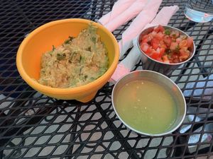 Side of chips (not shown) with guacamole and two sides of salsa that we chose. at Gringo A Go Go in Raleigh