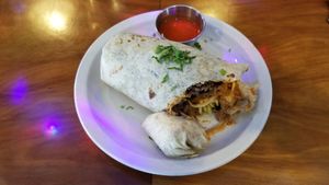 Vegan Carnitas Burrito.  Carnitas are cooked in delicious sauce.  Overall mild, but flavorful burrito. at Gringo A Go Go in Raleigh