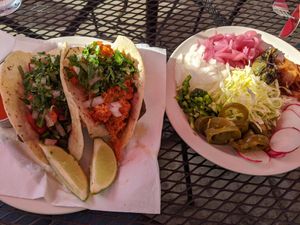 Nopales and vegan carnitas tacos with condiment tray at Gringo A Go Go in Raleigh