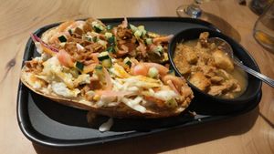 Hoy honey chicken on pretzel bun at The Burrowing Owl in Colorado Springs