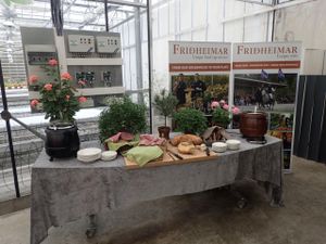 Fresh Soup and Bread Table. The temperature, lighting and watering controls are behind the table. The germination greenhouse is in the background. at Fridheimar in Reykholt