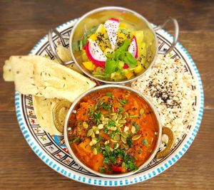 dish of the day - a nice curry, with a savory fruit salad, rice, and papadams at Ahimsa Vegan Restaurant and Club in Wroclaw