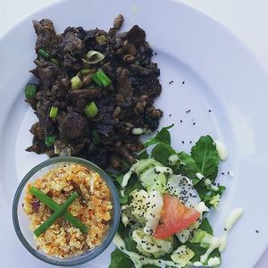 Oyster & Shitake Mushroom Saute with quinoa salad and arugula at Joga in Cole Bay