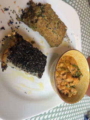 Main meal - curry, potatoes (with the black seeds on top) and a sorghum ‘tart'  at Fram Cafe in Bologna