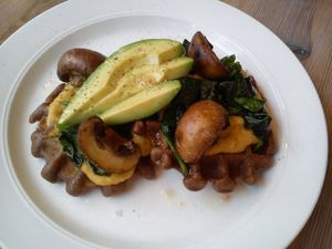buckwheat waffles with sweet potato hummus mushrooms spinach and avocado 
with a pinch of himalayas sea salt and black pepper  at Think Love Juices & Vegan Food in Warsaw