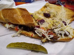 The Grateful Vegan Sub (Marinated Artichoke Hearts, Roasted Red Peppers, Vegan Cheese, Kalamata Olives, and Oregano) at Peace Love and Pizza - East Cobb in Marietta
