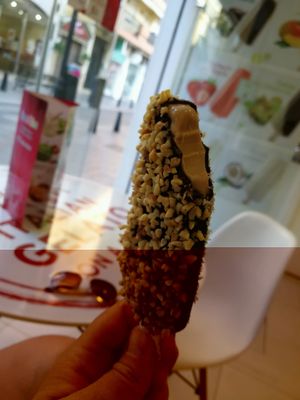 Hazelnut icecream dipped in dark chocolate drizzled with hazelnuts at Stickhouse in Fuengirola