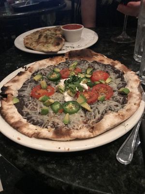 Roasted ‘chicken’ pizza without chicken as they ran out of vegan chicken - still very good  at Louisiana Pizza Kitchen in New Orleans