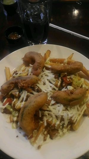 loaded fries with beer battered avocado  at Pancho's Kitchen in Las Vegas
