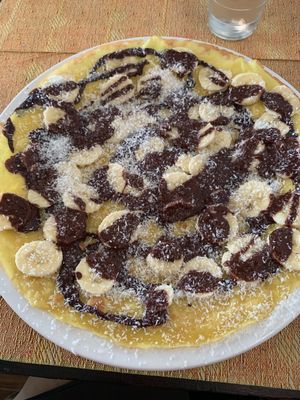 VEGAN Crepe with dark chocolate, bananas, and shredded coconut.  at Crepe de la Joie in Paris
